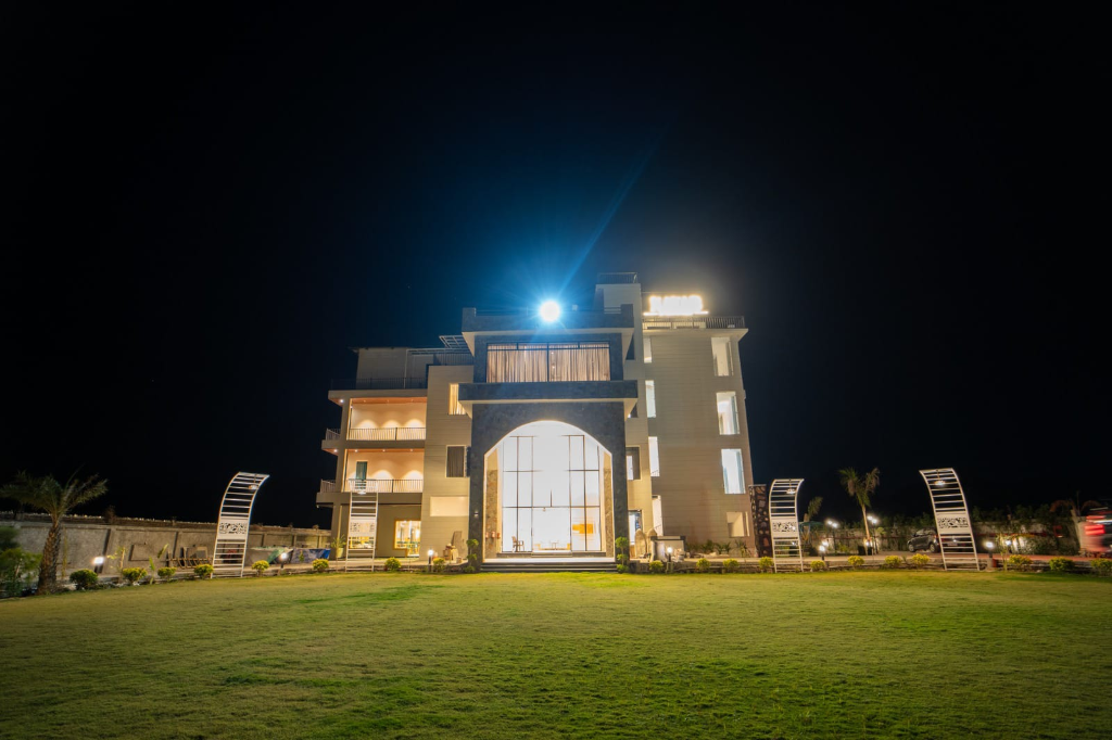 Grand Resort Facade & Illuminated Night Lawn