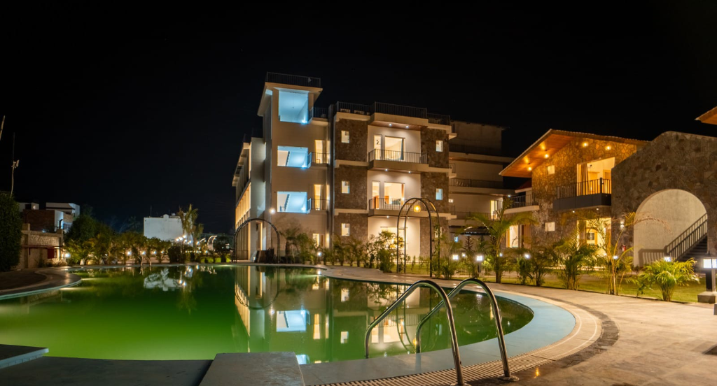 Illuminated Multi-Story Stone Architecture & Pool
